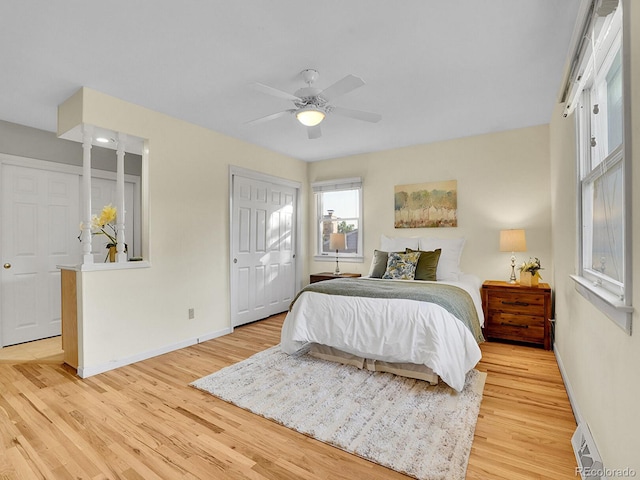 6844 S Detroit Cir, Centennial, CO 80122 - bedroom featuring light wood-style floors, a ceiling fan, and a baseboard heating unit