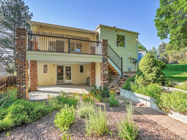 6844 S Detroit Cir, Centennial, CO 80122 - rear view of property featuring a patio, stairway, and a wooden deck