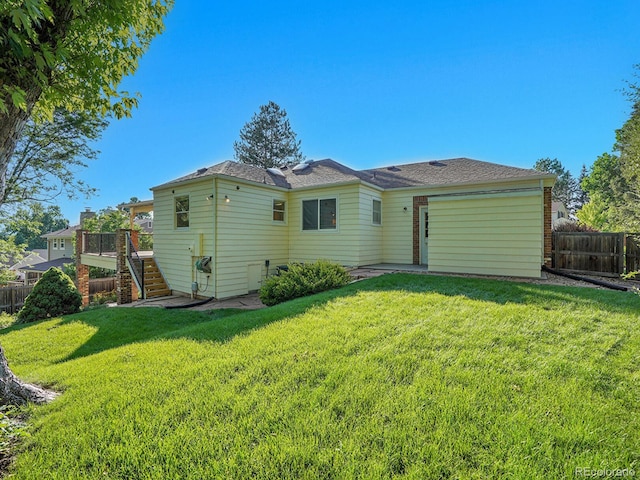 6844 S Detroit Cir, Centennial, CO 80122 - back of property with stairway, a fenced backyard, and a wooden deck