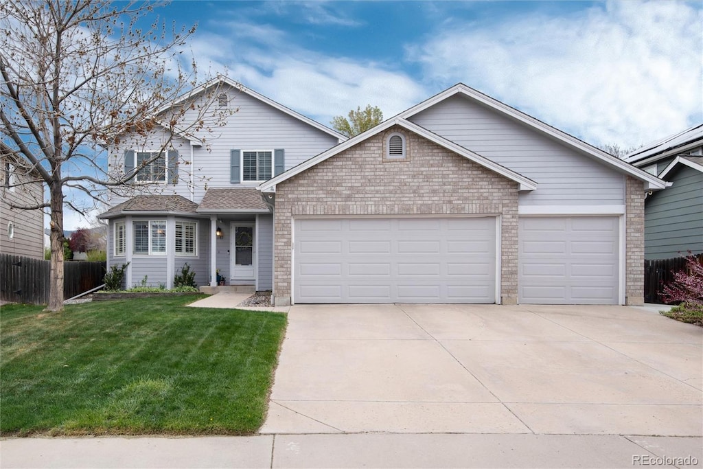 11181 W Crestline Dr, Littleton, CO 80127 - traditional-style house with a garage, driveway, and brick siding