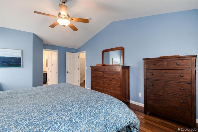 bedroom with dark wood-style flooring, vaulted ceiling, baseboards, ceiling fan, and ensuite bathroom