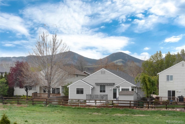 ranch-style home featuring a mountain view