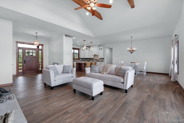 living room featuring high vaulted ceiling, dark hardwood / wood-style floors, and ceiling fan with notable chandelier