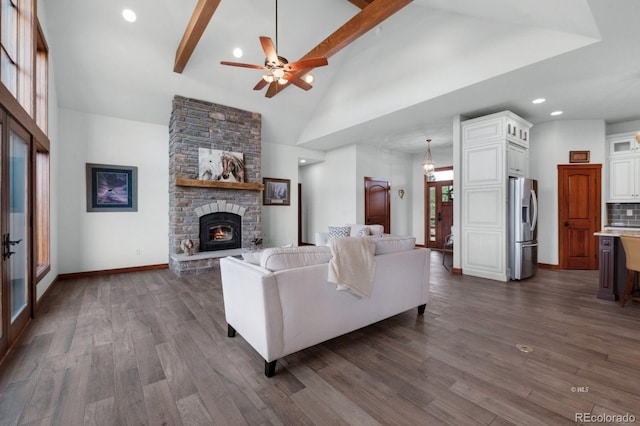 living room with high vaulted ceiling, beam ceiling, dark hardwood / wood-style flooring, and a fireplace