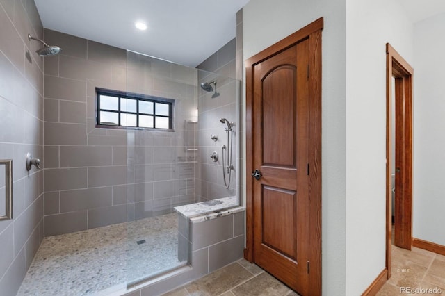 bathroom with tiled shower