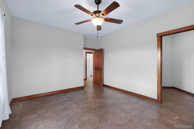 spare room with ceiling fan