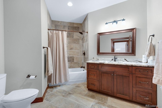 full bathroom with vanity, toilet, and shower / tub combo with curtain