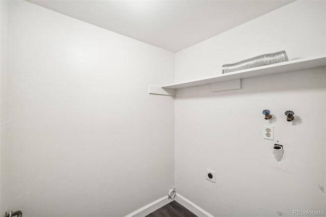 laundry room with dark wood-type flooring, hookup for a washing machine, and electric dryer hookup