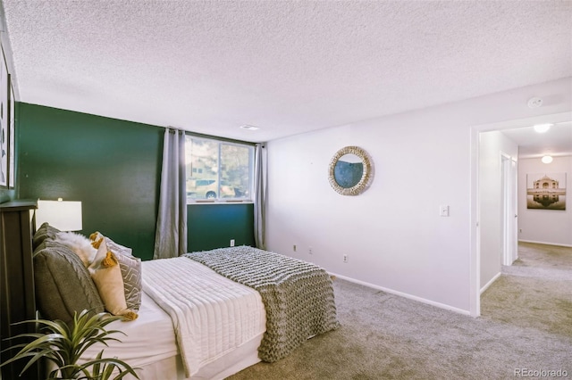 carpeted bedroom featuring a textured ceiling