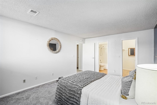 12470 E Cornell Ave Unit 104, Aurora, CO 80014 - carpeted bedroom with a textured ceiling and connected bathroom