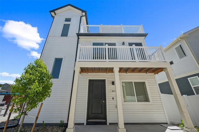 18211 E 51st Ave, Denver, CO 80249 - rear view of house with a balcony and fence