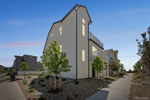 18211 E 51st Ave, Denver, CO 80249 - view of side of property featuring a balcony and central AC
