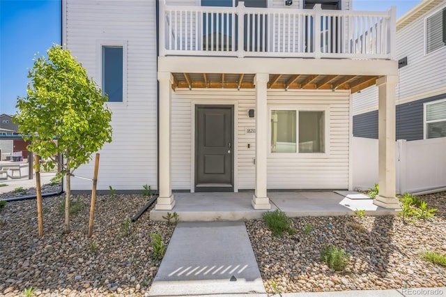 18211 E 51st Ave, Denver, CO 80249 - property entrance with a balcony and fence