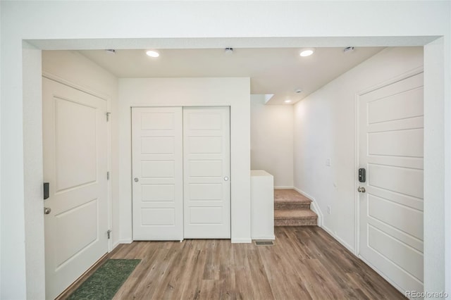 18211 E 51st Ave, Denver, CO 80249 - entrance foyer with light wood-type flooring, recessed lighting, baseboards, and stairs