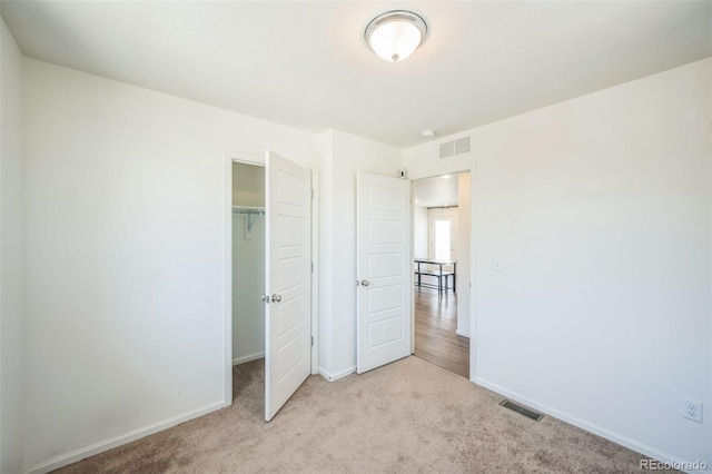 18211 E 51st Ave, Denver, CO 80249 - unfurnished bedroom featuring carpet, baseboards, and a closet
