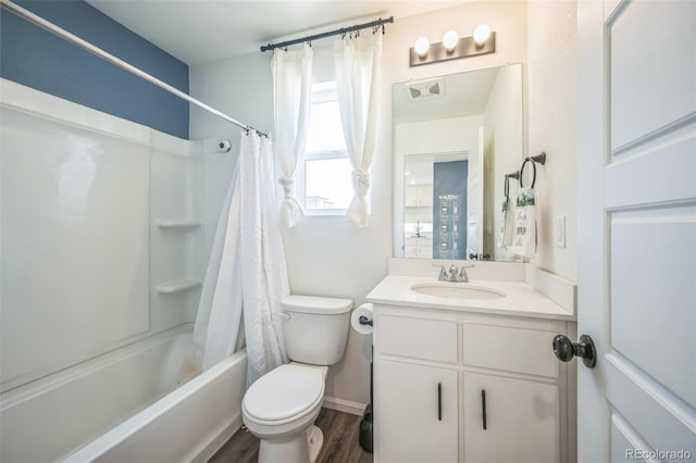18211 E 51st Ave, Denver, CO 80249 - full bathroom featuring vanity, toilet, shower / tub combo with curtain, and wood finished floors