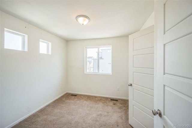18211 E 51st Ave, Denver, CO 80249 - unfurnished bedroom featuring carpet and baseboards