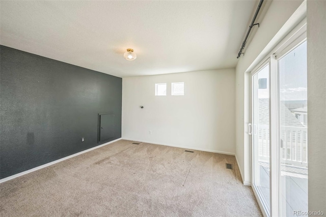 18211 E 51st Ave, Denver, CO 80249 - carpeted spare room featuring baseboards