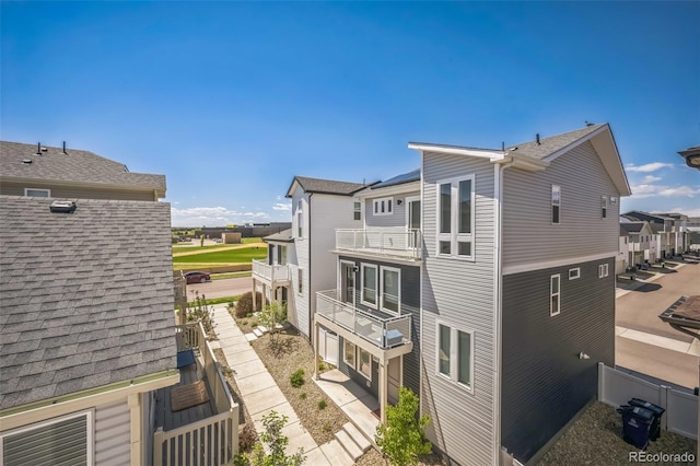 18211 E 51st Ave, Denver, CO 80249 - view of side of property featuring a balcony and a residential view
