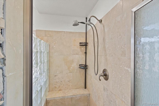 bathroom featuring tiled shower