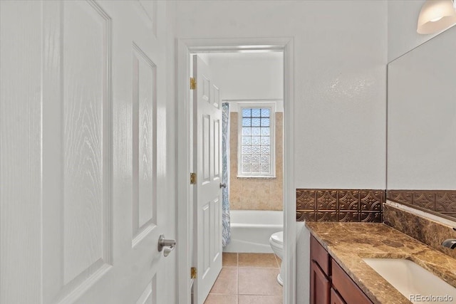 full bathroom with tile patterned flooring, vanity, toilet, and shower / washtub combination