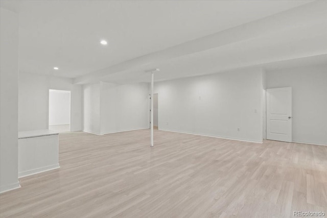 basement featuring light wood-type flooring