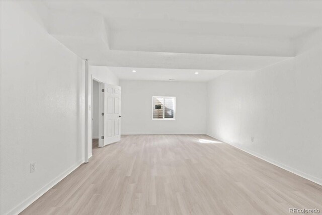 spare room with light wood-type flooring