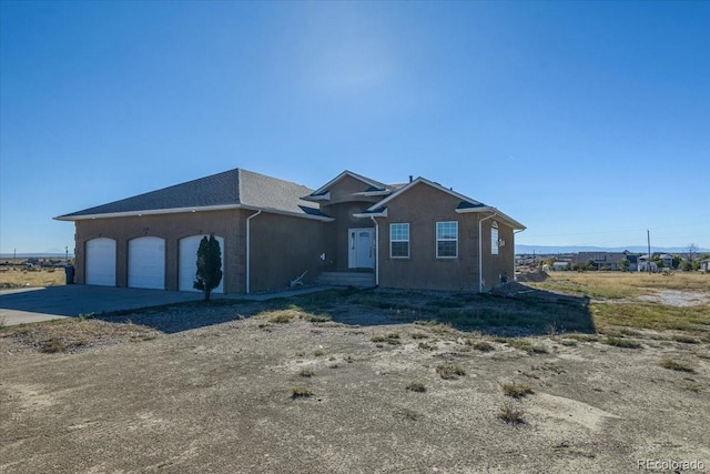 view of front of property with a garage