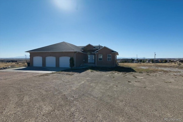 view of front of home with a garage