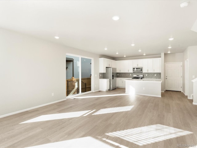 unfurnished living room featuring light hardwood / wood-style flooring