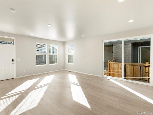 unfurnished living room featuring light hardwood / wood-style flooring