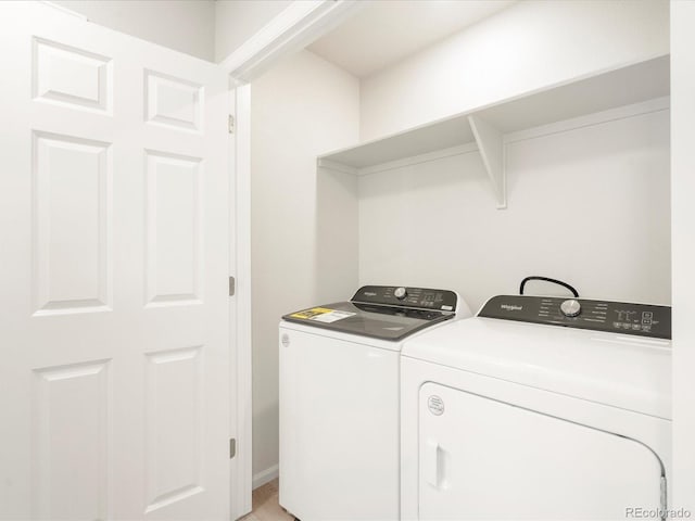 laundry area with washing machine and clothes dryer