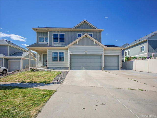 19155 Robins Dr, Denver, CO 80249 - view of front of property featuring concrete driveway, an attached garage, and a porch
