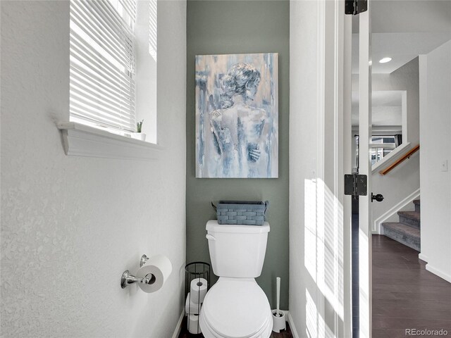19155 Robins Dr, Denver, CO 80249 - half bathroom featuring toilet and wood finished floors
