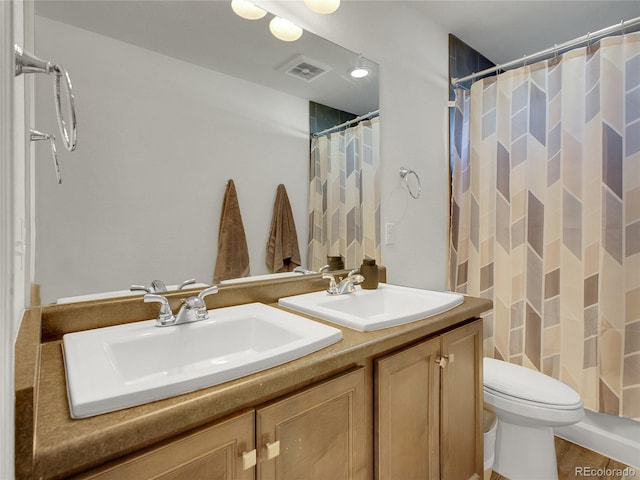 19155 Robins Dr, Denver, CO 80249 - bathroom with double vanity and a shower with curtain