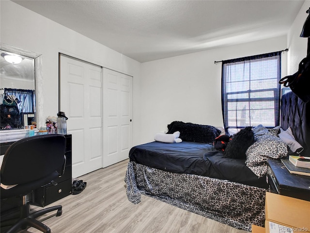 19155 Robins Dr, Denver, CO 80249 - bedroom with wood finished floors, a closet, and a desk