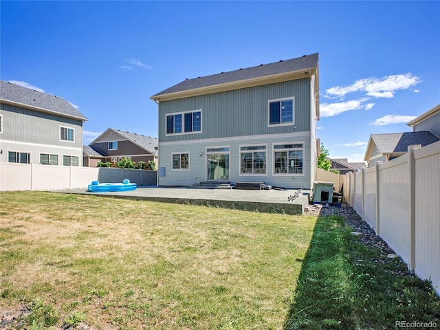 19155 Robins Dr, Denver, CO 80249 - back of property featuring a patio area and a fenced backyard