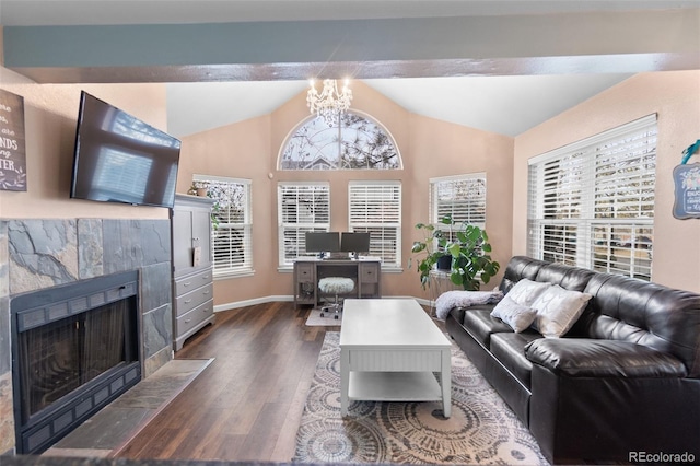 living room with a fireplace, vaulted ceiling with beams, dark hardwood / wood-style flooring, and a notable chandelier