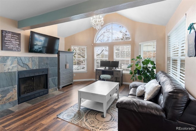 living room featuring vaulted ceiling with beams, an inviting chandelier, a fireplace, and dark wood-type flooring