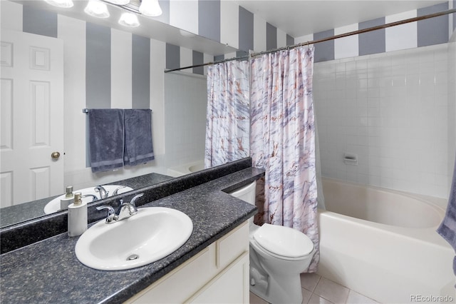 full bathroom featuring tile patterned floors, vanity, toilet, and shower / tub combo with curtain