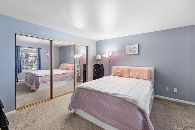 bedroom with a closet and carpet floors