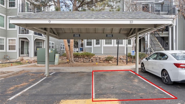 view of vehicle parking featuring a carport