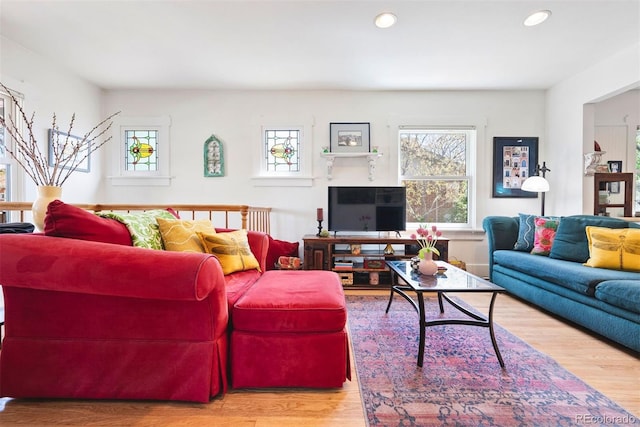 living room featuring recessed lighting and wood finished floors