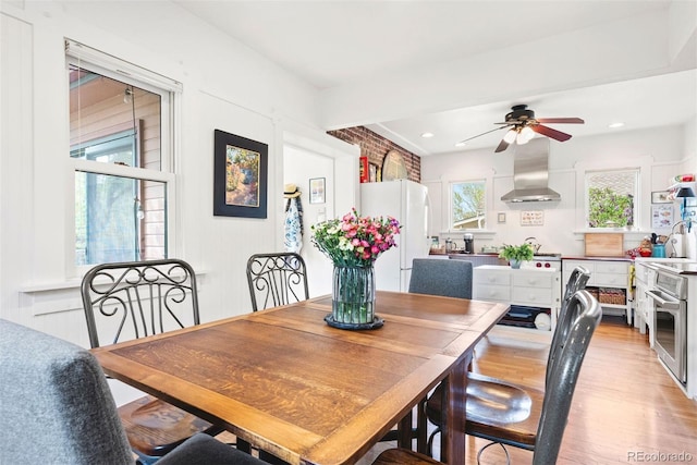 dining area with recessed lighting, a ceiling fan, and light wood finished floors