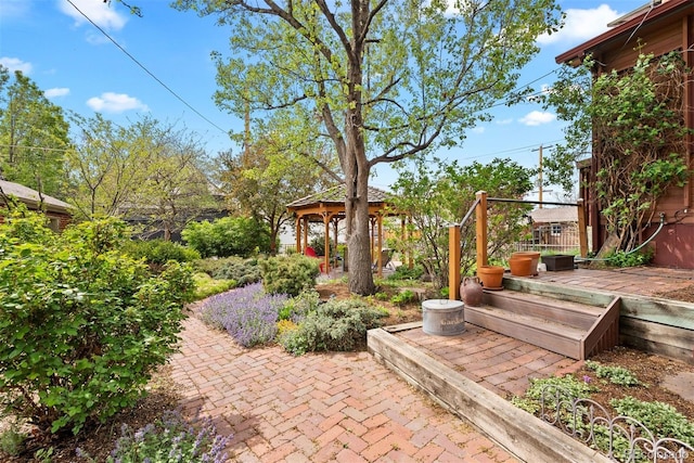 view of yard featuring a gazebo and a deck
