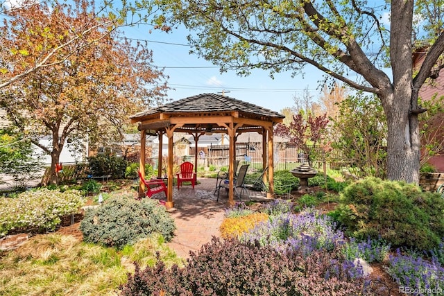 view of yard featuring a patio, a gazebo, and fence
