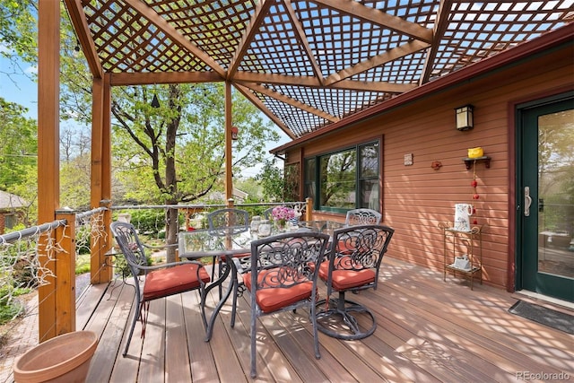 wooden terrace featuring outdoor dining area