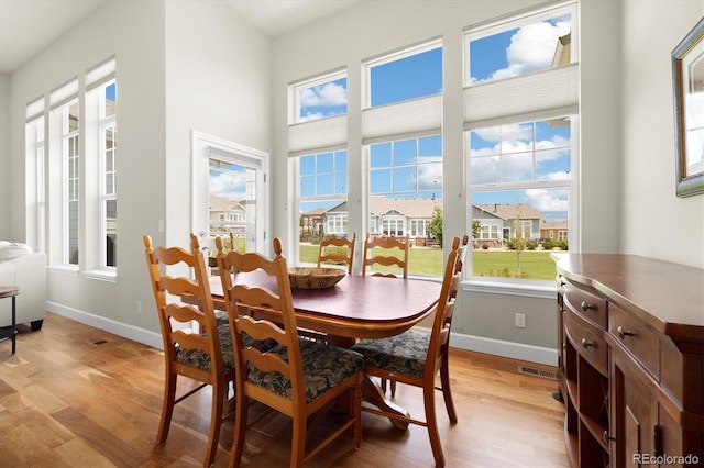 14443 W 88th Dr Unit B, Arvada, CO 80005 - dining area with light wood-style flooring and baseboards