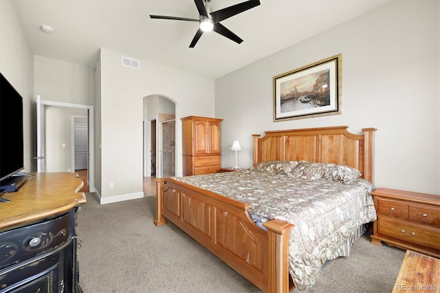 14443 W 88th Dr Unit B, Arvada, CO 80005 - bedroom featuring arched walkways, light carpet, and a ceiling fan