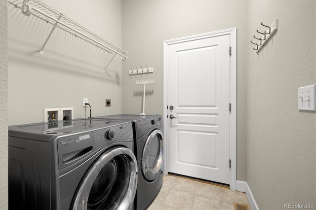 14443 W 88th Dr Unit B, Arvada, CO 80005 - washroom featuring separate washer and dryer and baseboards